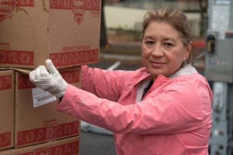 Woman carrying boxes of food